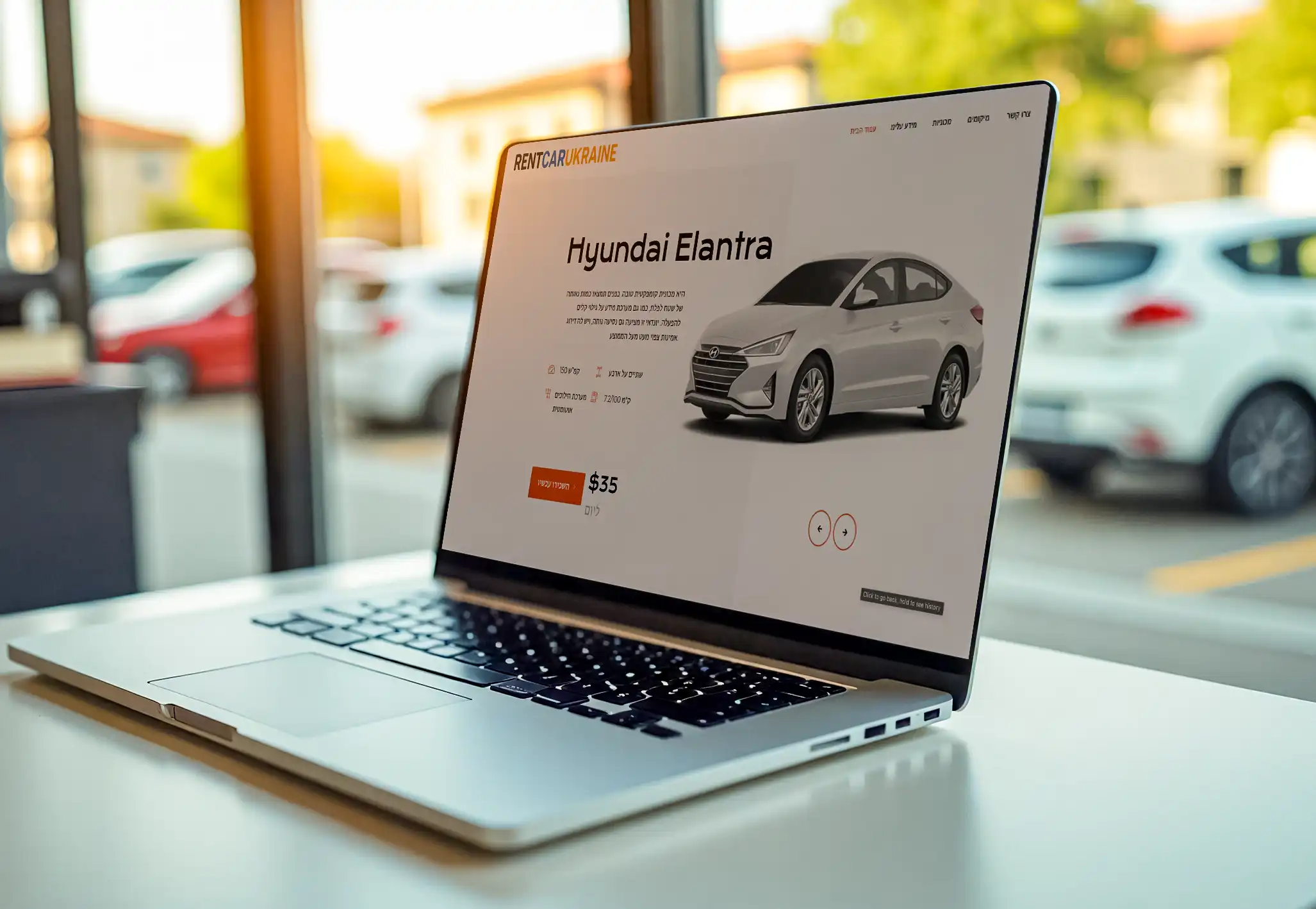 http://laptop%20on%20the%20table%20with%20car%20rental%20servoce%20website%20design