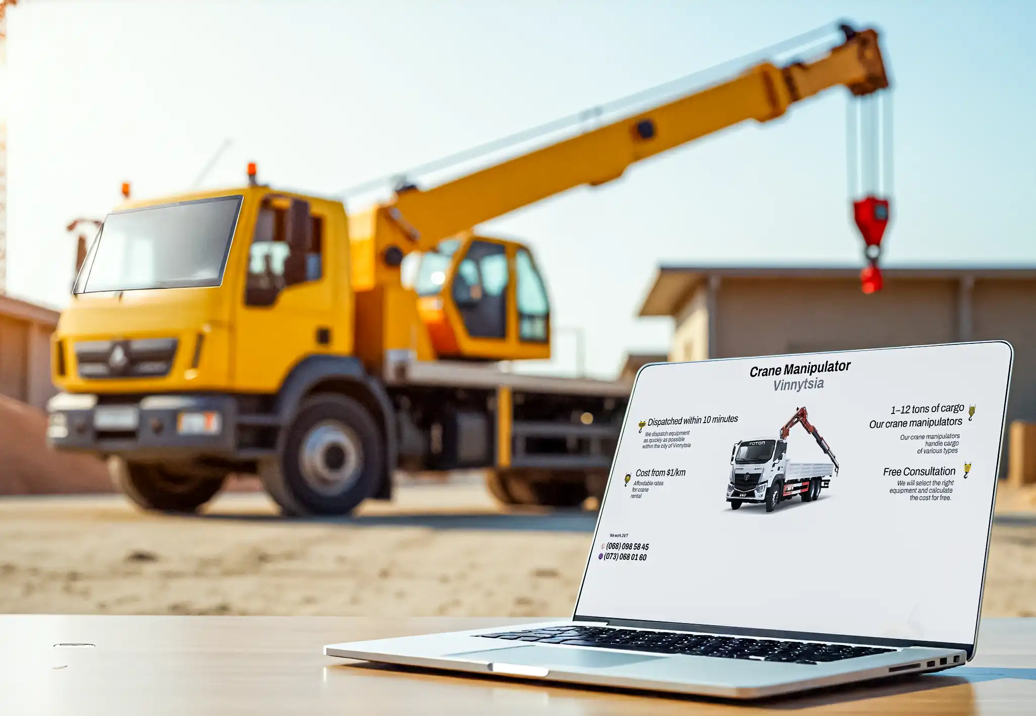 http://laptop%20on%20the%20table%20with%20crane%20manipilator%20service%20website%20design
